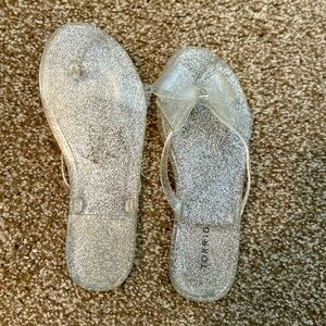 Torrid size 9WW clear/silver glitter jelly flip flops. Worn once.